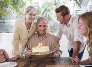 Caucasian family celebrating birthday at table