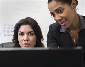 Businesswomen using computer in office