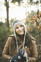Caucasian woman wearing knitted cap in park