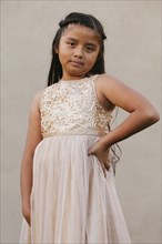 Hispanic girl wearing party dress