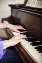 Close up of Caucasian woman musician playing piano