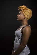Profile of Black woman wearing headwrap