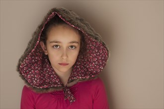 Sad Caucasian girl wearing hood