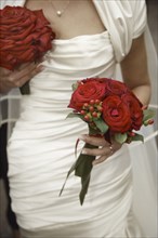 Close up of bride holding bouquets