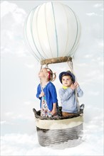 Children playing in pretend hot air balloon