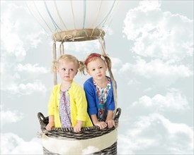 Girls playing in pretend hot air balloon