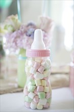 Close up of candy baby bottle gift