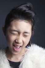 Close up of Asian girl blinking