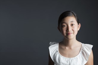 Smiling Asian girl looking at camera