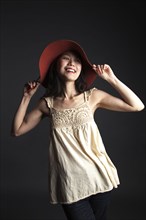 Asian woman wearing red hat