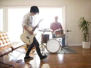 Couple playing music in living room