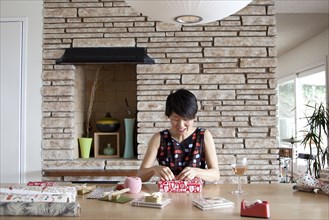 Japanese woman wrapping gifts