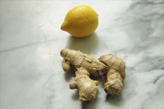 Fresh ginger root and lemon