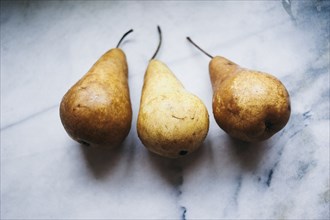 Close up of pears on marble counter