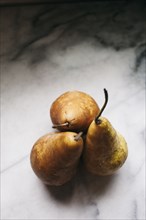 Close up of pears on marble counter