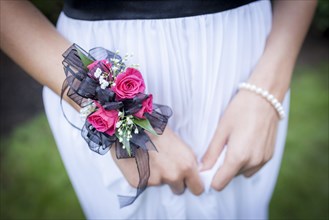 Close up of teenage girl in prom attire wearing corsage