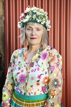 Stylish older Caucasian woman wearing floral cap