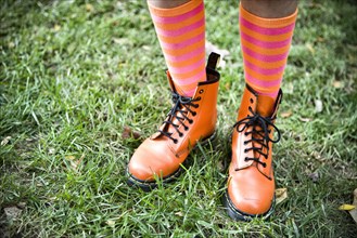Close up of girl wearing colorful socks and boots