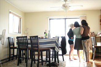 Women standing in dining room