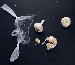 Garlic bulbs and netting on counter top