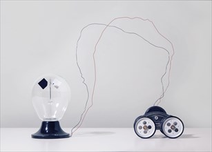 Wire connecting toy car to light bulb