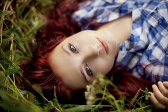 Close up of girl laying in grass