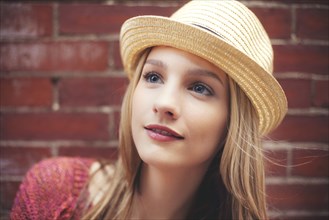 Close up of girl wearing straw hat