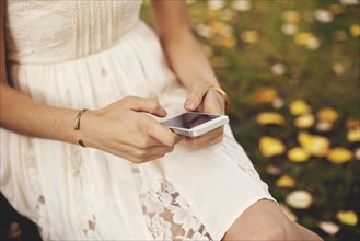 Close up of woman using cell phone outdoors