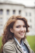 Caucasian student smiling on college campus