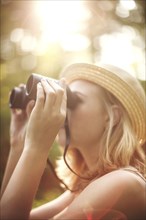Caucasian woman looking through binoculars