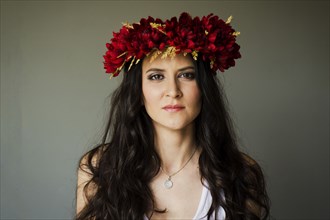 Serious woman wearing flower crown