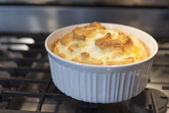 Close up of baked souffle on stove