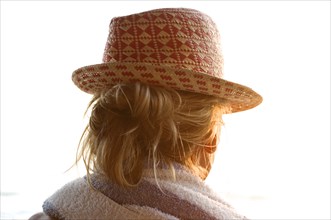 Rear view of woman wearing straw hat