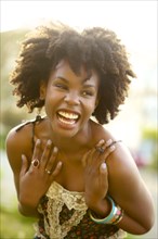 Smiling woman laughing outdoors