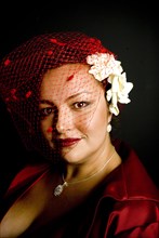 Mixed race woman wearing birdcage veil