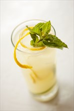 Close up of glass of lemonade with garnish