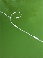 High angle view of buoy cord in lake