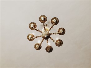 Low angle view of chandelier hanging from ceiling