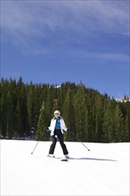 Woman skiing on snowy slope