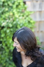 Close up of laughing woman in backyard