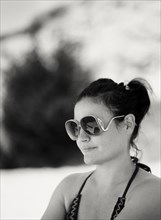 Close up of woman wearing sunglasses outdoors