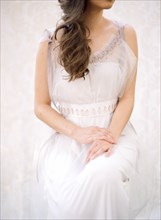 Bride sitting in wedding dress