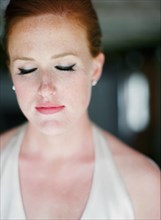 Close up of glamorous bride with eyes closed