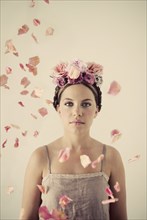 Serious woman wearing flowers in her hair