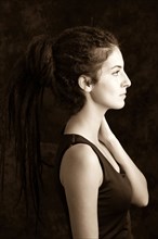 Close up profile of serious woman with dreadlocks