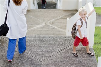 Doctor and son walking on steps