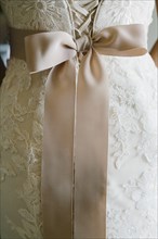 Close up of sash on wedding dress