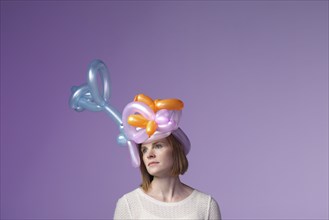 Woman wearing balloon hat