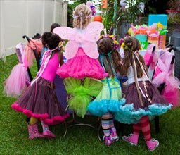 Girls playing dress-up at birthday party