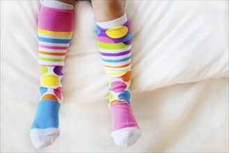 Close up of child wearing colorful socks